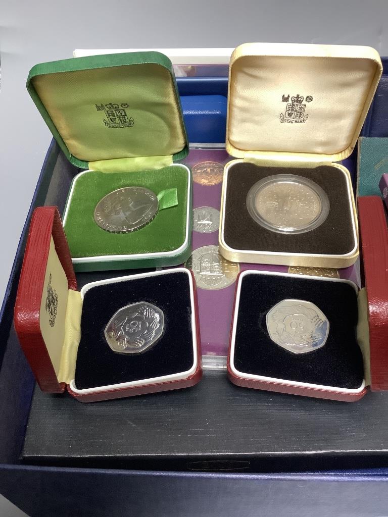 Three UK proof coin sets: Royal Shield Arms 2008, and 2005 and 2008 year sets, other UNC coins and 18th century and later world coins